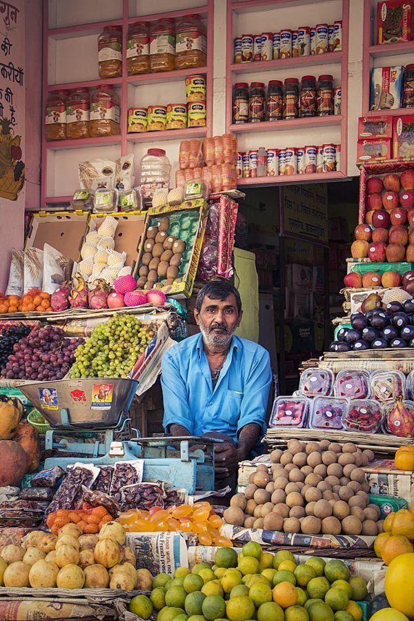 Vendor at a colourful Mumbai market stall