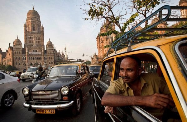 Black and yellow taxi in front of the BMC building, South Mumbai